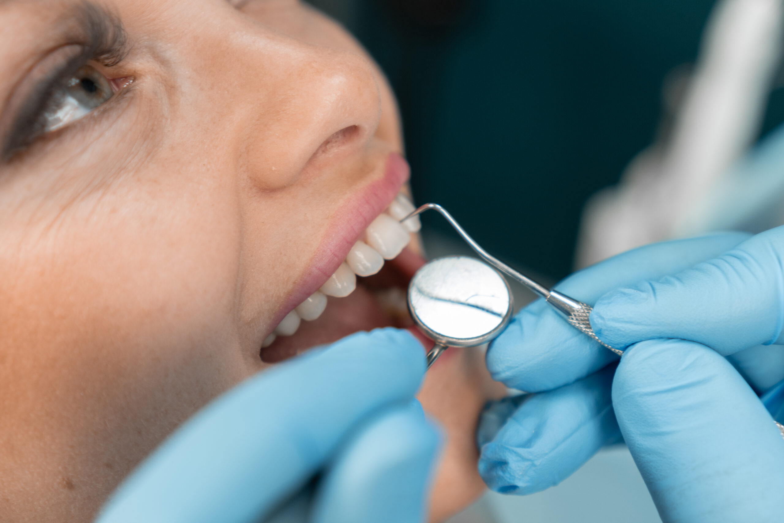 Dental examination and diagnostics. Satisfied woman sitting comfortably in dental chair expressing her gratitude for excellent smile health care The dentist is ready to provide her with long-term support and advice. High quality photo